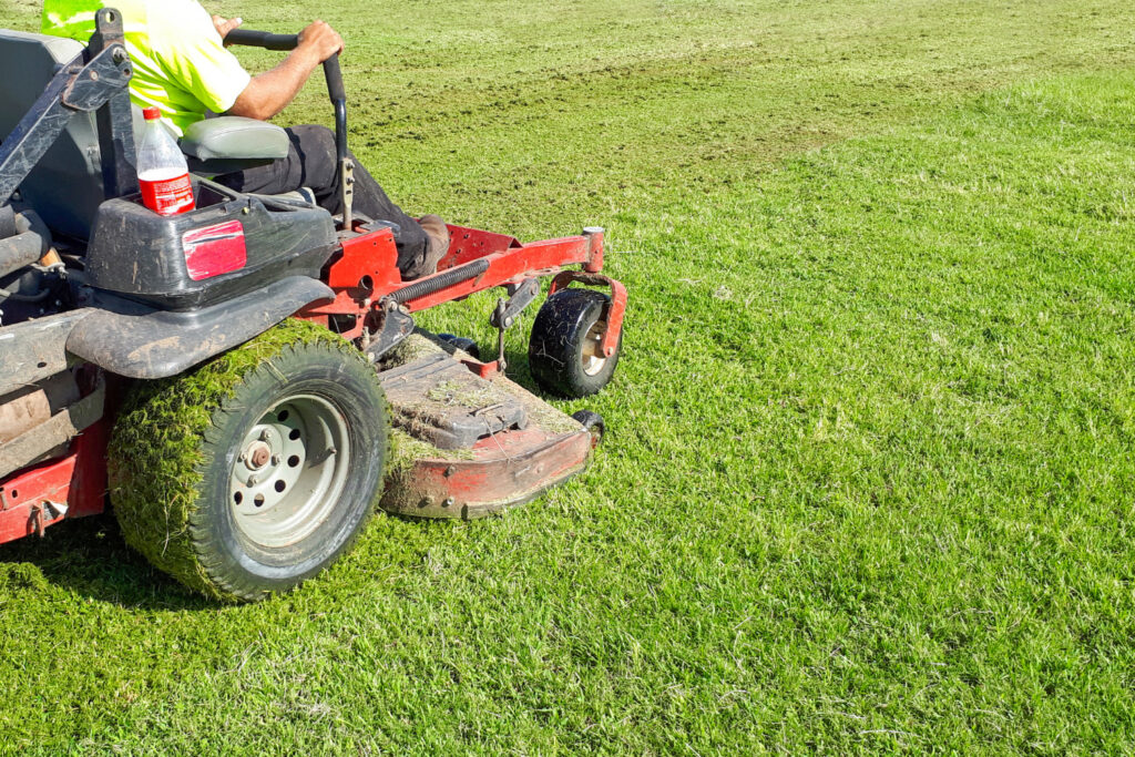 auto-lawn-mower-man-rides-lawn-mower-lawn-care-riding-mower-grass